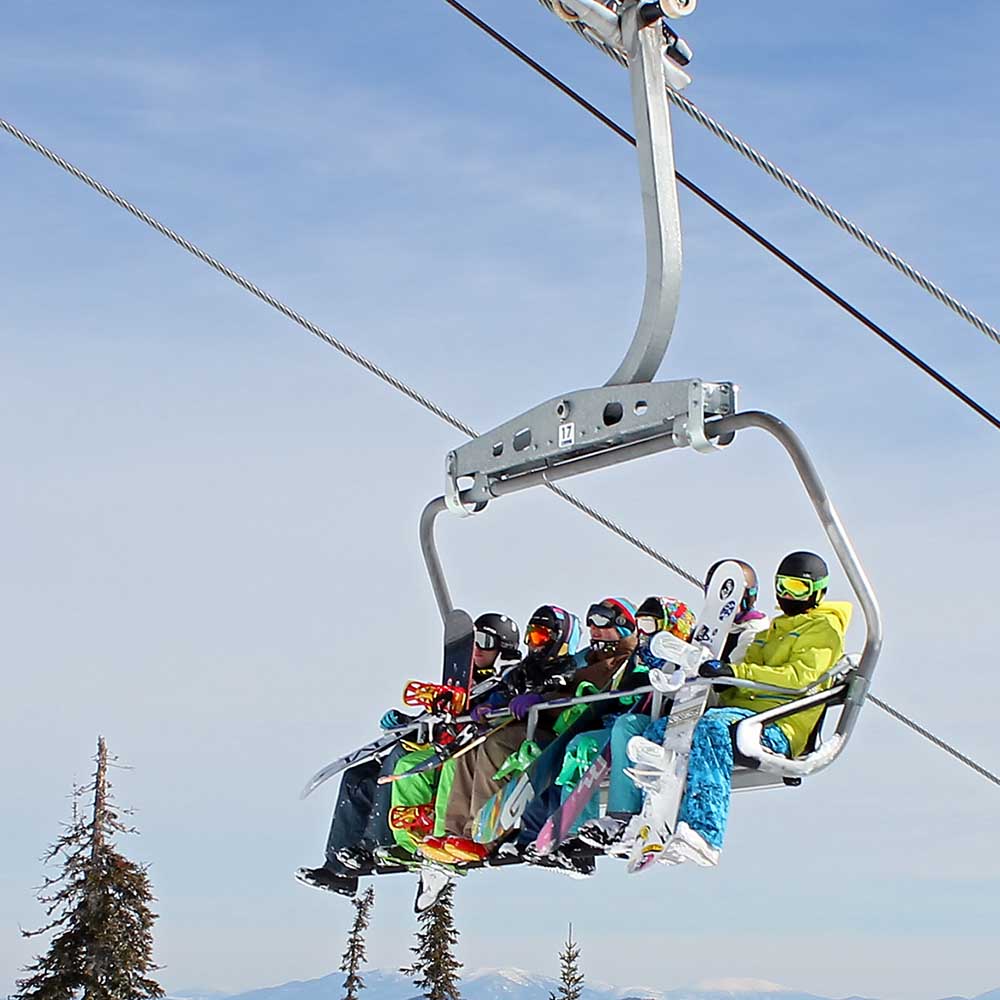 Skiers on a chair lift